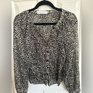 Sheer animal print blouse.